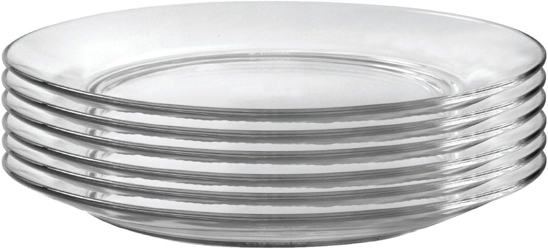 Set of clear glass plates stacked on a white background