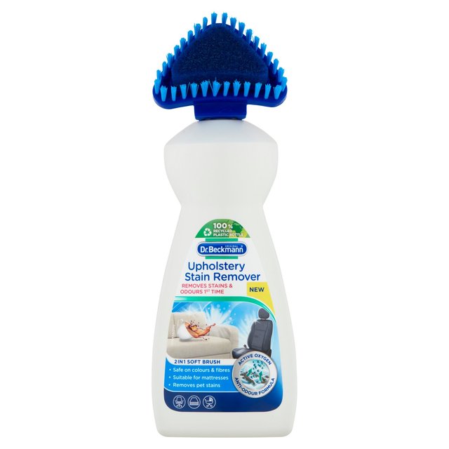 Upholstery stain remover bottle with brush for sofas and car seats.